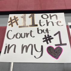 a sign that says 11 on the court but 1 in my heart is written on it