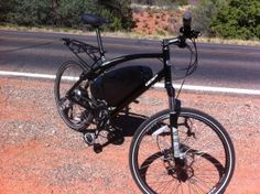 a bicycle is parked on the side of the road