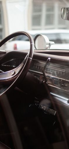 the interior of a car with dashboard and steering wheel