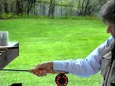 a man is cooking on an outdoor grill