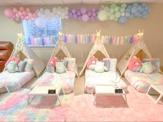 a room decorated in pastel colors with teddy bears and balloons