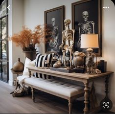 a living room filled with furniture and skeletons on the wall next to a window sill