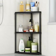 a shelf in the corner of a bathroom filled with personal care items