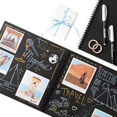 an open notebook with pictures and writing on it next to pens, scissors and markers