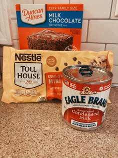 ingredients to make chocolate cake sitting on a counter next to a package of milk and cookies