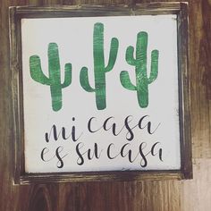 a wooden sign that says cactus and succulenta on the side of a wall