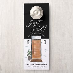 a door hanger with the words just sold on it and an image of a wooden door