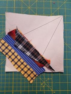 a piece of paper with some fabric on it