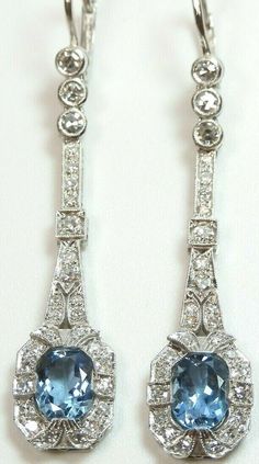 ART DECO SANTA MARIA NATURAL AQUAMARINE + DIAMOND EARRINGS (See Video Below) {International Buyers Are Responsible For Customs & Duty Fees} Circa ~ 1930'S 2 ~ Natural Aquamarines Shape ~ Oval Color ~ Medium - Dark Blue 1 ~ 8.12 MM x 6.10 MM x 3.91 MM (1.11 Carat) 1 ~ 8.02 MM x 6.10 MM x 3.65 MM (1.07 Carat Size ~ 2.18 Carat Total Weight Country Of Origin ~ Brazil (Santa Maria Mines) 56 ~ Round Single Cut Natural Diamonds Total Weight ~ 1.10 Carat Color ~ F - G Clarity ~ VS 1 - VS 2 Overall Lengt Platinum Art Deco Earrings For Anniversary, Art Deco Platinum Earrings For Anniversary, Classic Platinum Drop Earrings, Classic Blue Platinum Earrings, Anniversary Platinum Art Deco Earrings, Formal Oval Art Deco Earrings, Art Deco White Gold Diamond Earrings, Oval Art Deco Earrings For Formal Occasions, Art Deco Formal Earrings Hallmarked