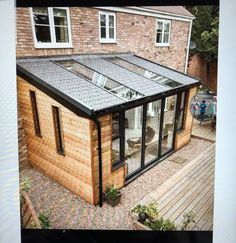 an image of a house that is made out of wood and brick with a glass roof