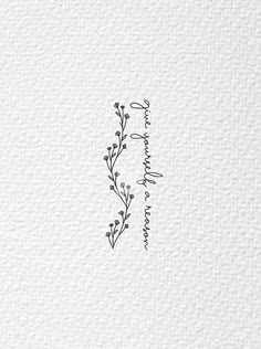 the letter i is written in black ink on white paper with an artistic floral design