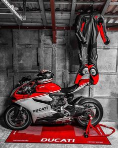 a ducati motorcycle parked in a garage