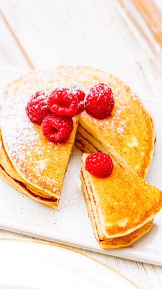 pancakes with raspberries and powdered sugar on top