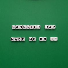 the word gangster rap made me do it spelled with cubes on a green background