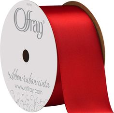 a red satin ribbon on a reel with the word ohray printed on it in white