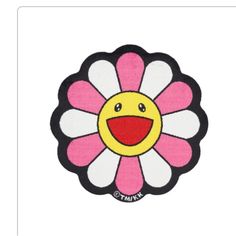 a pink and white flower with a smiling face