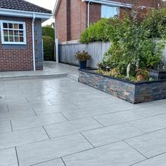 an outdoor patio with potted plants on it