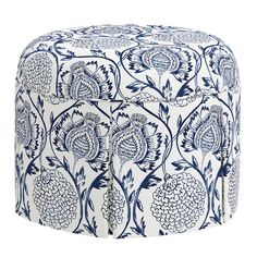 a blue and white poufce with flowers on it