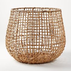 a wicker basket sitting on top of a white table