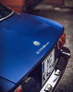 the back end of a blue sports car