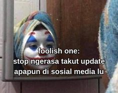 a mirror with a clown's face painted on it and the caption reads, foolish one