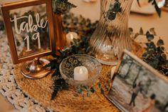 a table topped with pictures and candles