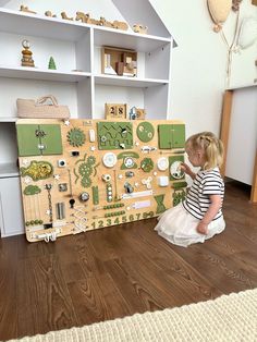 Introducing our toddler busy board - a popular and multifunctional toy that promotes essential skill development in children. Designed for the age at which important neural connections are formed (up to three years), this sensory board enhances fine motor skills, coordination, independence, household and self-care abilities, perseverance, and dexterity. It also improves tactile sensitivity, logic, memory, imagination, and ingenuity. Serving as a smart alternative to gadgets, it engages your chil Busy Board Table, Sensory Boards For Toddlers, Fidget Board, Tactile Sensitivity, Busy Board Baby, Sensory Wall, Neural Connections, Sensory Board, Busy Boards For Toddlers