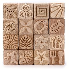 several wooden blocks with different designs on each one side and an image of the same design