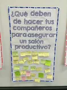 a bulletin board with post it notes on it and spanish words written on the back