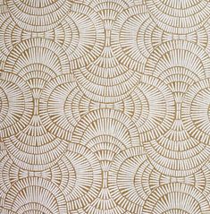 a white and gold wallpaper with circles on it