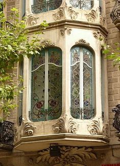 an ornate window on the side of a building