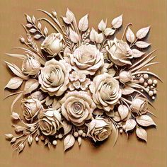 an intricately designed flower arrangement on a brown background