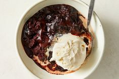 a bowl filled with ice cream and chocolate cake