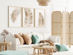 a living room with couches, tables and paintings on the wall above them in shades of green