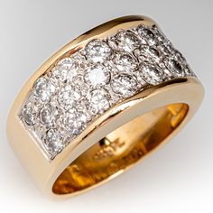 This beautiful wide band diamond ring is accented with twenty-three (23), bead set, round brilliant cut diamonds. The ring measures 9.6mm at the top, rises 4.4mm above the finger, tapering to 6.3mm wide and 1.3mm thick at the base of the soft European shank. It is currently a size 6. Luxury Yellow Gold Domed Wide Band Ring, Luxury Thick Band Dome Ring For Formal Events, Luxury Wide Band Diamond-cut Jewelry, Luxury Wide Band Jewelry With Diamond Accents, Modern Diamond Cocktail Rings, Thick Diamond Ring, Thick Diamond Band, Wide Diamond Wedding Bands, Thick Band Engagement Ring