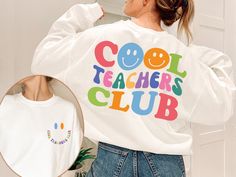 Cool Teacher Club Sweatshirt, Retro Teacher Sweatshirt, Cool Teacher Sweatshirt, Back To School Shirt, Teacher Gifts, Funny Teacher Sweater Welcome to Style Art US! 𝐒𝐈𝐙E  𝗔ND 𝐂𝐎𝐋𝐎𝐑𝐒: For  size and color options,  please see listing images. Gildan Brand, 50% cotton, medium weight and soft. Usually runs true size.  DTF printing method is used for these shirts. 𝗛𝗢𝗪 𝗧𝗢 𝗢𝗥𝗗𝗘𝗥: 𝟏. Please, check and review listing photos. 𝟐. Select Your T-Shirt size and color from drop down menus. 𝟒. Choose Your Quantity you want. 𝟒. Click 𝗔𝗗𝗗 𝗧𝗢 𝗖𝗔𝗥𝗧. Go to your card and finalize your order. CARE INSTRUCTIONS: Turn the shirt inside out. Machine wash cold with mild detergent. Tumble dry very low. Do not use bleach. Do not iron directly on design. RETURNS and CANCELLATION: If the i Relaxed Fit Long Sleeve T-shirt For School, Cool Long Sleeve Cotton Tops, White Long Sleeve T-shirt With Funny Text, White School Spirit T-shirt For Winter, Winter School T-shirt With Letter Print, Cute Long Sleeve College T-shirt, Trendy Long Sleeve Tops With Funny Text, White Long Sleeve Tops With Funny Text, Funny Text Long Sleeve Cotton Sweatshirt