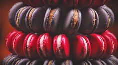 red and black macaroons stacked on top of each other