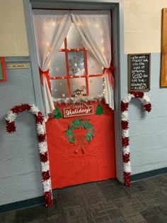 a door decorated with christmas decorations and lights