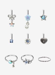 six pairs of rings with charms on them