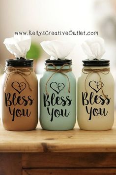 three mason jars with tissue paper in them that say, i love you and bess you