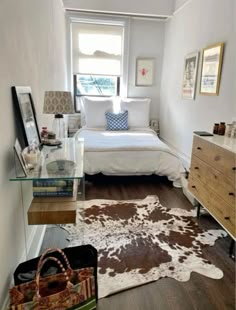 a bedroom with a cow hide rug on the floor