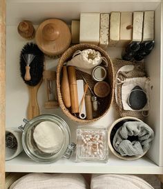 an organized kitchen drawer filled with items for baking and other crafting projects, including wooden spoons