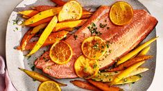 salmon, carrots and potatoes on a plate