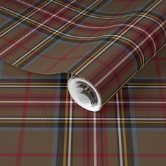 a brown and red plaid wallpaper with white trim