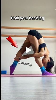 a woman doing a handstand on top of a pink yoga mat with the words hold your back leg above her head