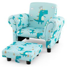 a blue chair and footstool with a dinosaur print