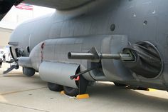 an air force jet sitting on the tarmac with it's fuel hose out