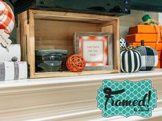 a fireplace mantel decorated for halloween with pumpkins and other decorations