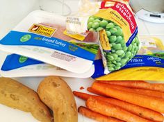 carrots, broccoli, potatoes and other food items on a counter top