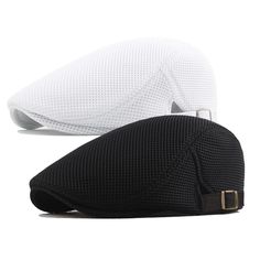 two white and black hats sitting next to each other